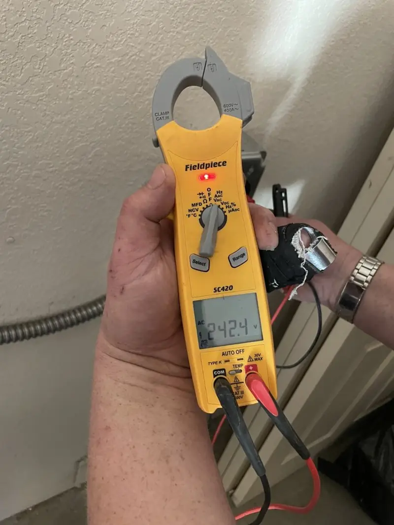 Voltage testing with clamp meter during Recessed Lighting Installation in Flat Rock